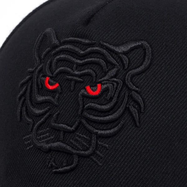 Black cap with a detailed tiger emblem featuring red eyes on a white background