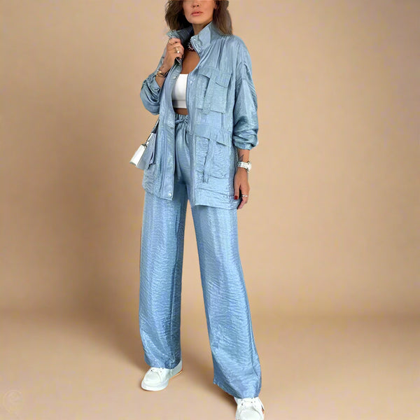 Woman wearing a blue denim outfit in a modern living room.