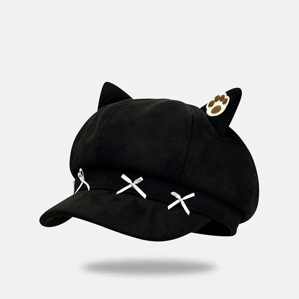 Black cat-themed cap with white accents on a light gray background