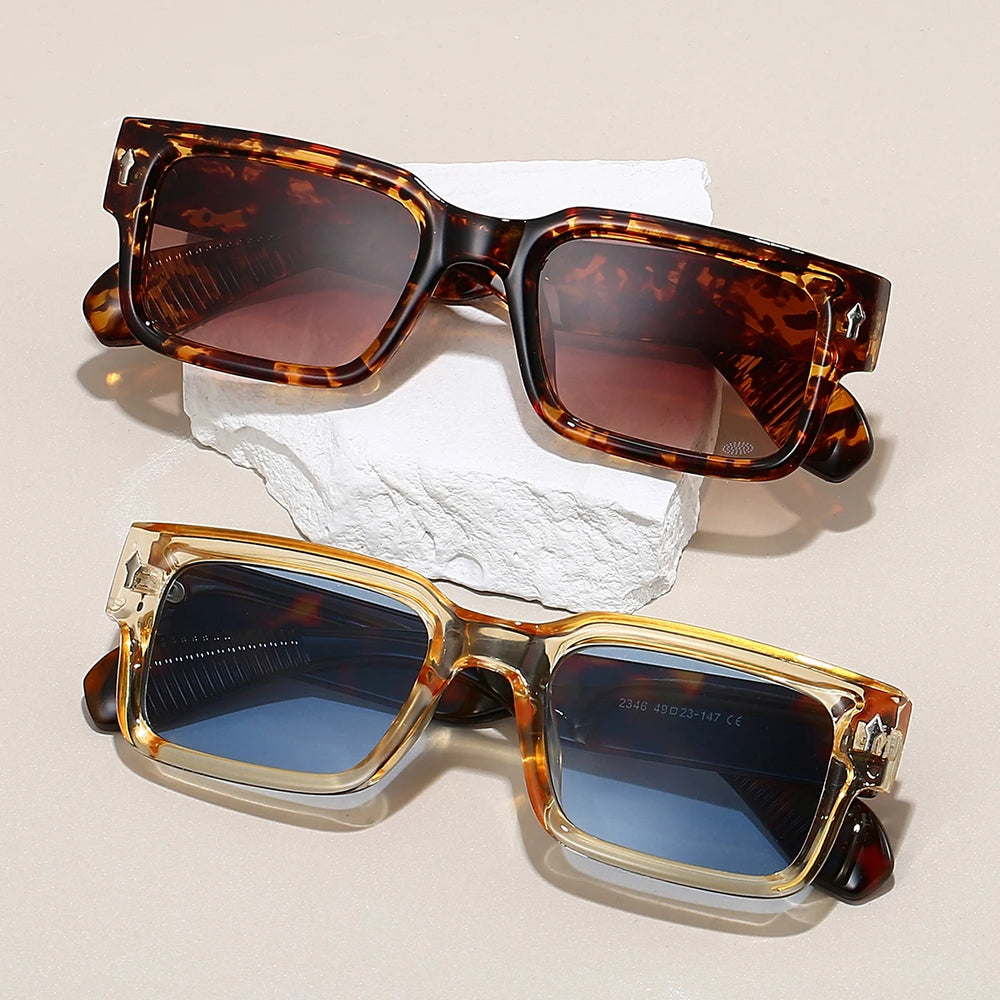 Sunglasses with tortoiseshell arms on a gray background