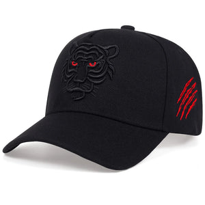 Black cap with tiger emblem and red accents on a white background