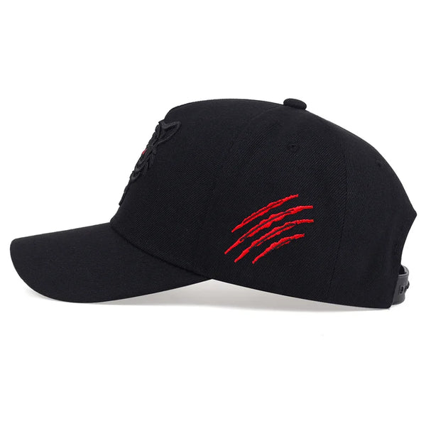 Black cap with red design on a white background