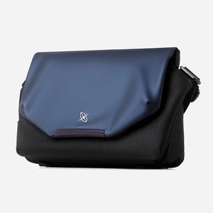 Blue and black bag with a visible brand logo on a white background