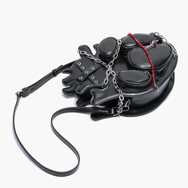 Black leather harness with gloves and collar on a white background