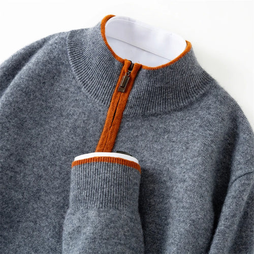 Gray sweater with orange zipper and trim on a white background