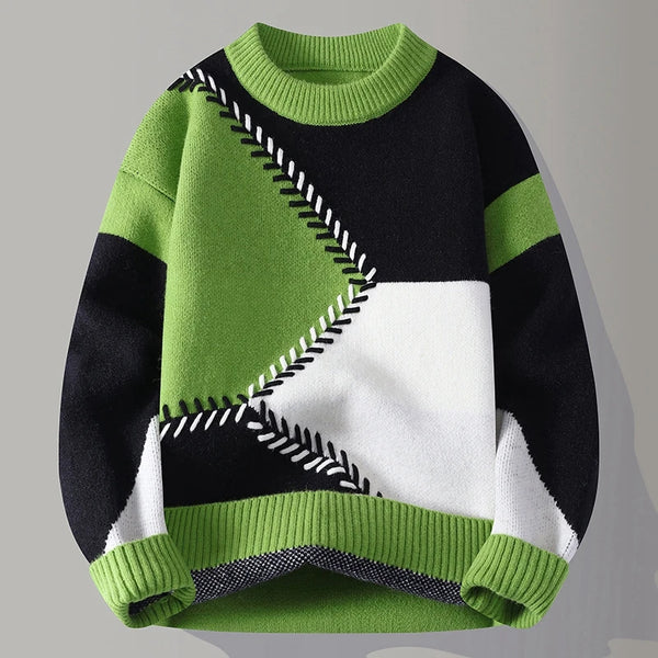 Color-blocked sweater with green, black, and white design on a gray background