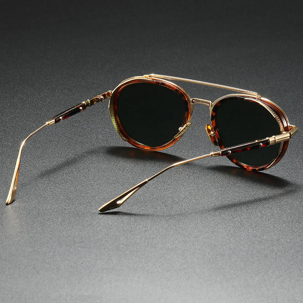 Sunglasses with tortoiseshell frame and dark lenses on a gray background