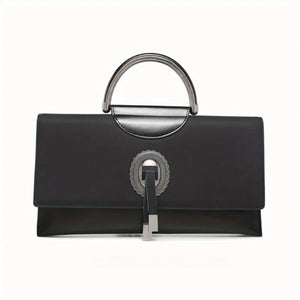 Black handbag with silver handle and clasp on a white background