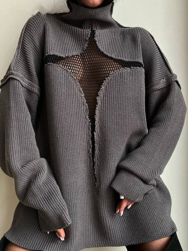 Person wearing a gray textured sweater with a mesh panel