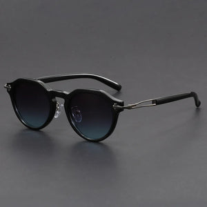 Black sunglasses with gradient lenses on a gray background