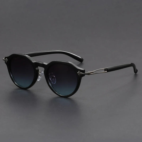 Black sunglasses with gradient lenses on a gray background