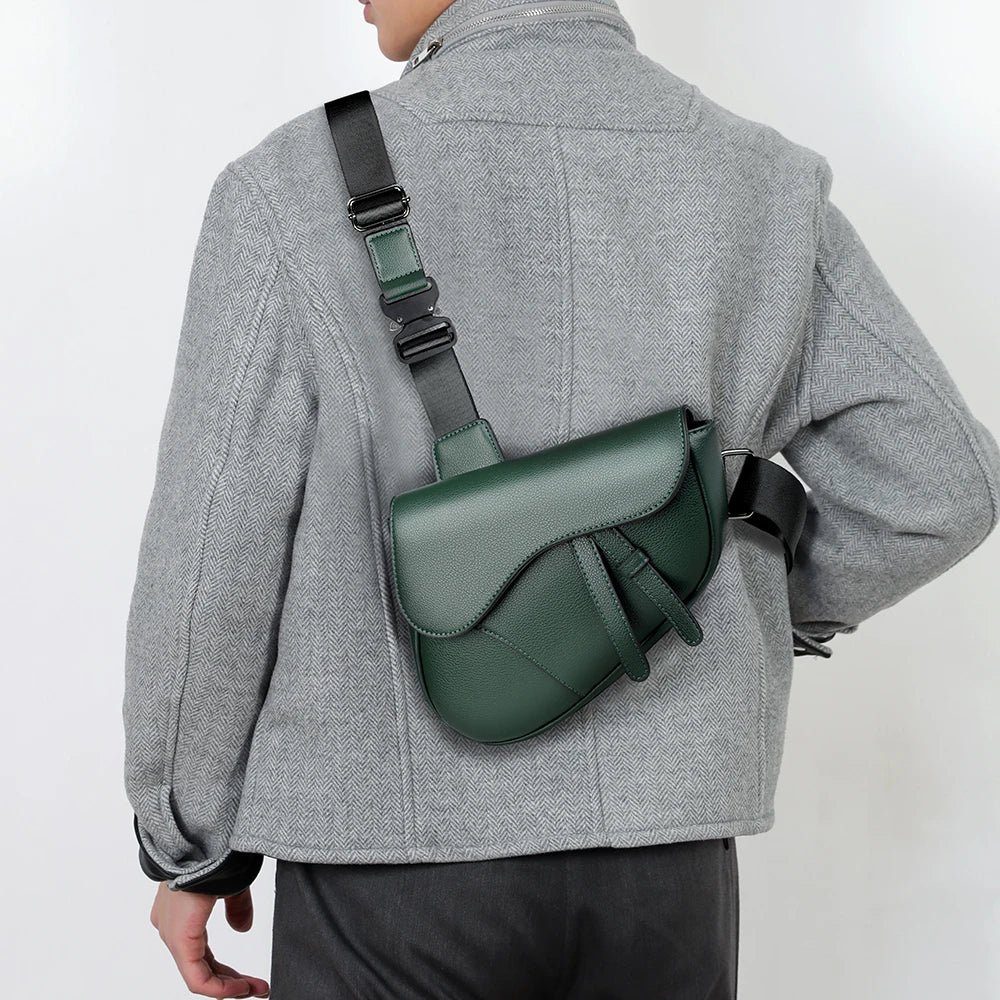 Person wearing a green shoulder bag on a plain background