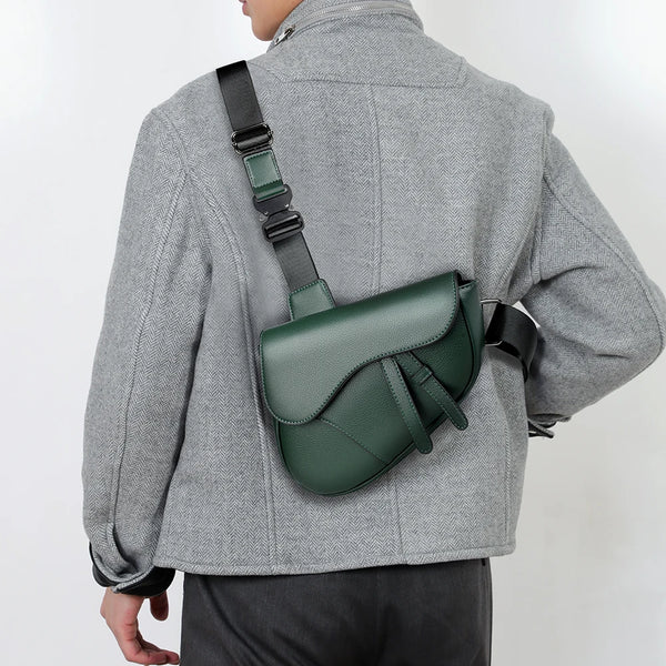 Person wearing a green shoulder bag on a plain background