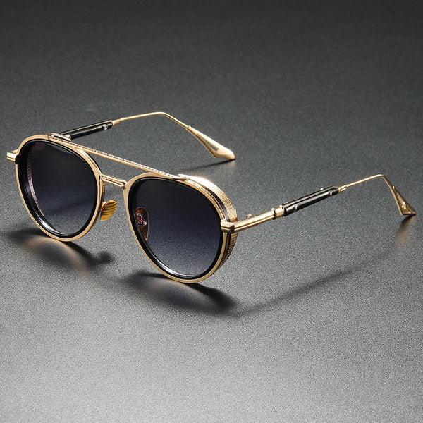 Gold-framed sunglasses with black lenses on a gray background