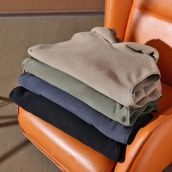 Stack of folded clothes on an orange chair