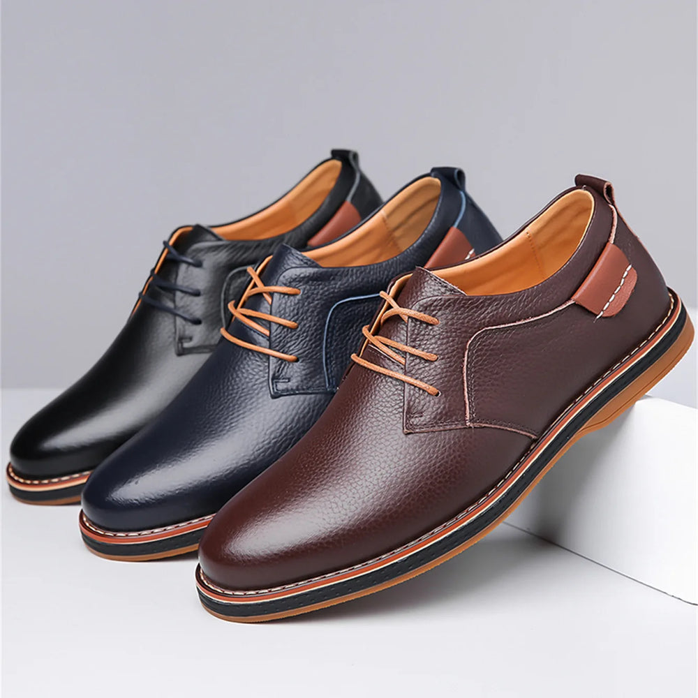 Three pairs of leather shoes in black, navy, and brown on a light gray background.