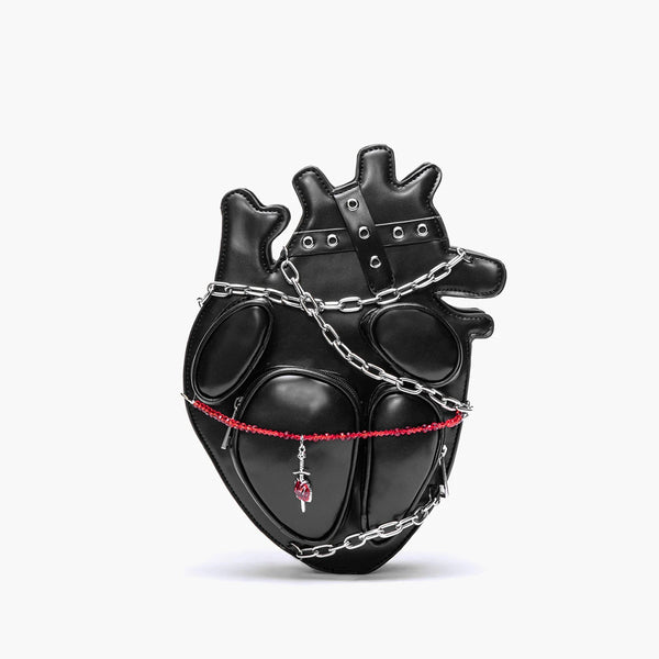Black heart-shaped bag with chains and a red ribbon on a white background
