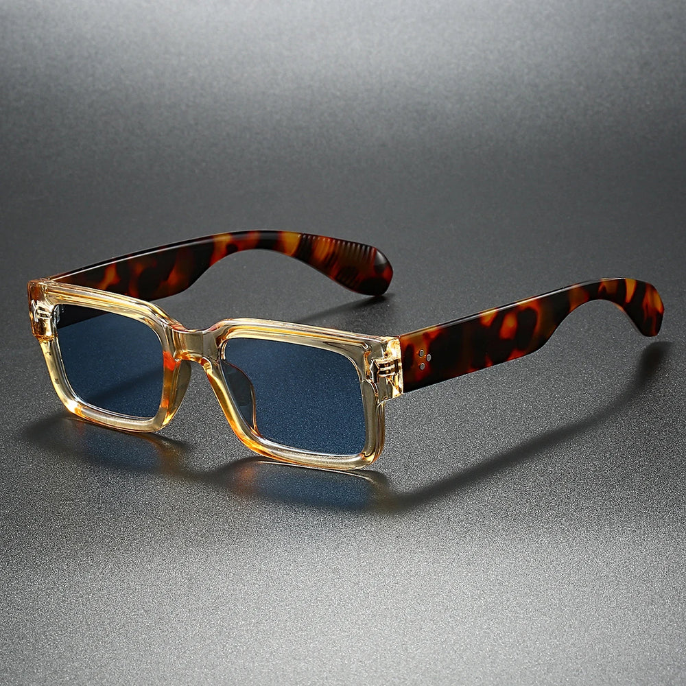 Sunglasses with tortoiseshell arms on a gray background