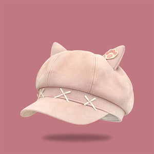 Pink cap with cat ears on a pink background