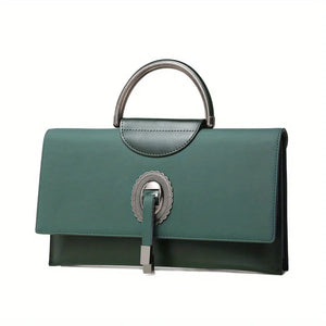 Green handbag with decorative clasp on a white background