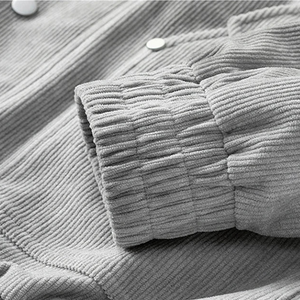 Close-up of a textured gray fabric with buttons