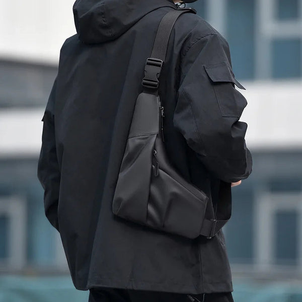 Person wearing a black backpack with a blurred background
