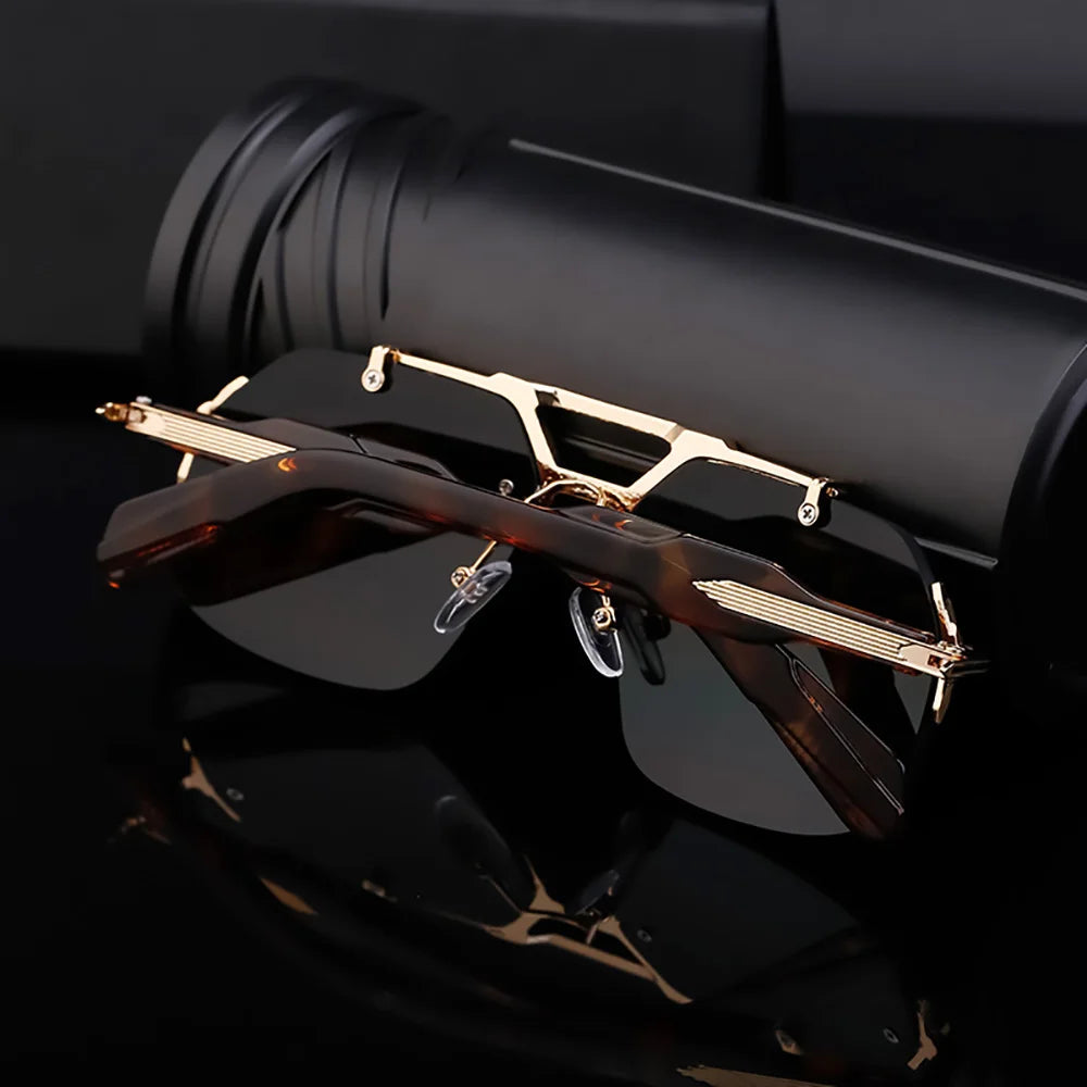 Black sunglasses with gold accents on a dark background
