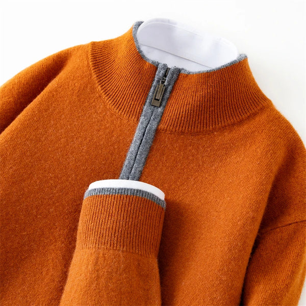 Orange sweater with a gray zipper on a white background