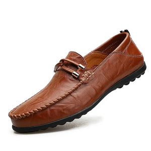 Brown leather loafer shoe on a white background
