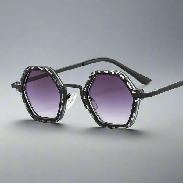 Sunglasses with a geometric frame and gradient lenses on a white background