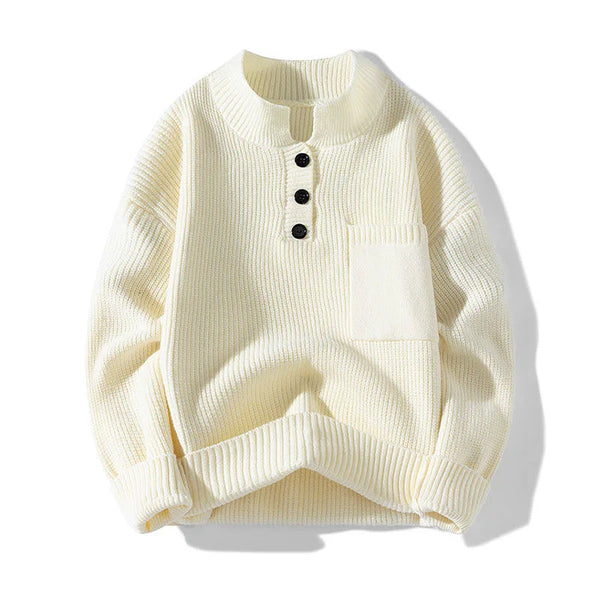 Cream-colored sweater with black buttons on a white background