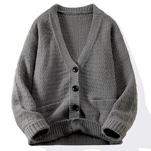 Gray cardigan with buttons on a white background