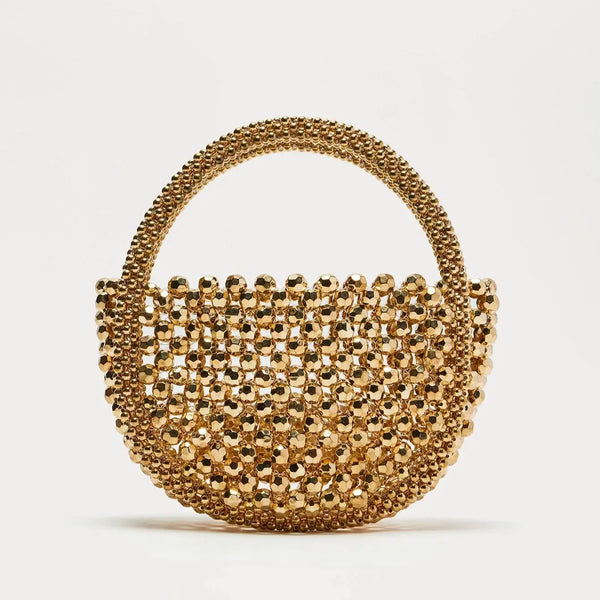 Gold beaded handbag on a white background
