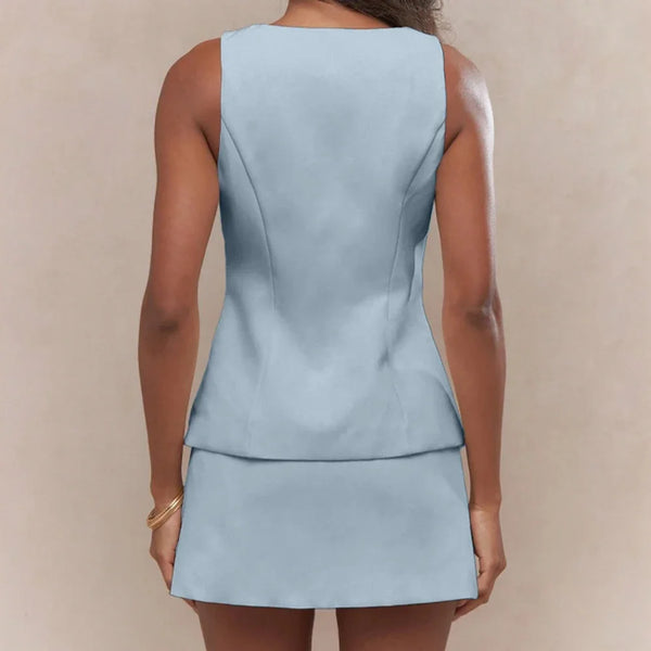 Light blue sleeveless top and skirt set on a neutral background