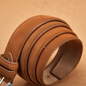 Close-up of a brown leather belt with visible brand name on a matching background