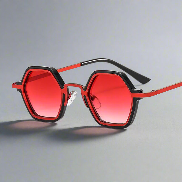 Red sunglasses with black frames on a white background