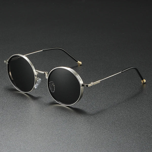 Round sunglasses with metallic frame on a dark gray background