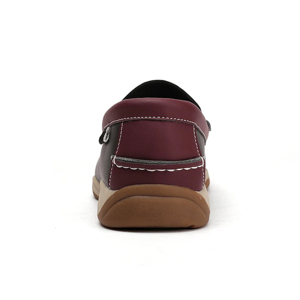 Maroon loafer shoe with brown sole on a white background
