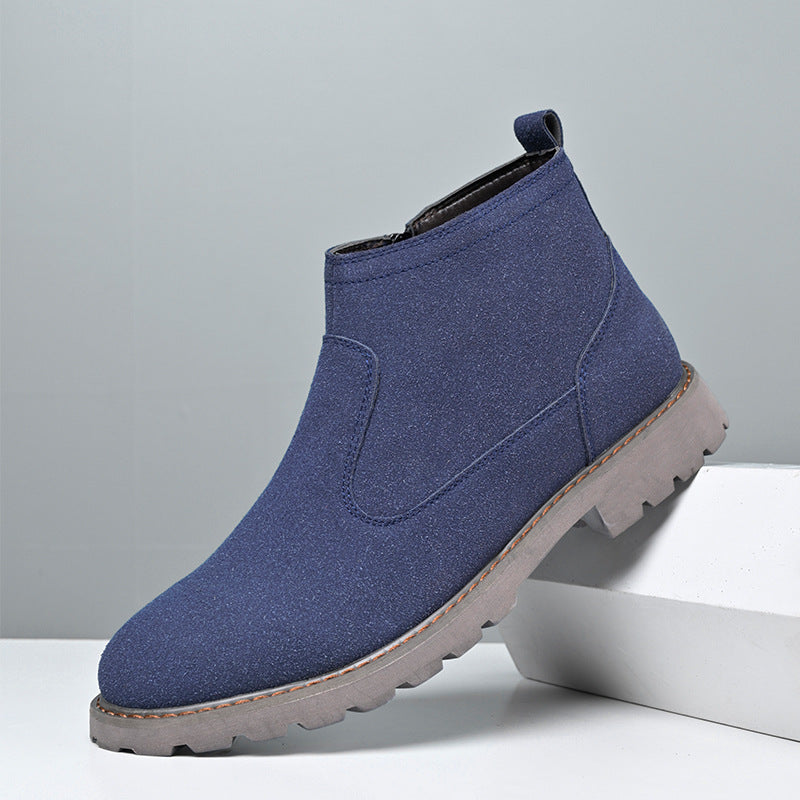 Blue ankle boot on a gray background