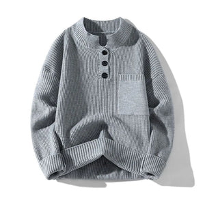 Gray knit sweater with button details on a white background