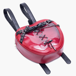 Red heart-shaped backpack with black accents on a white background