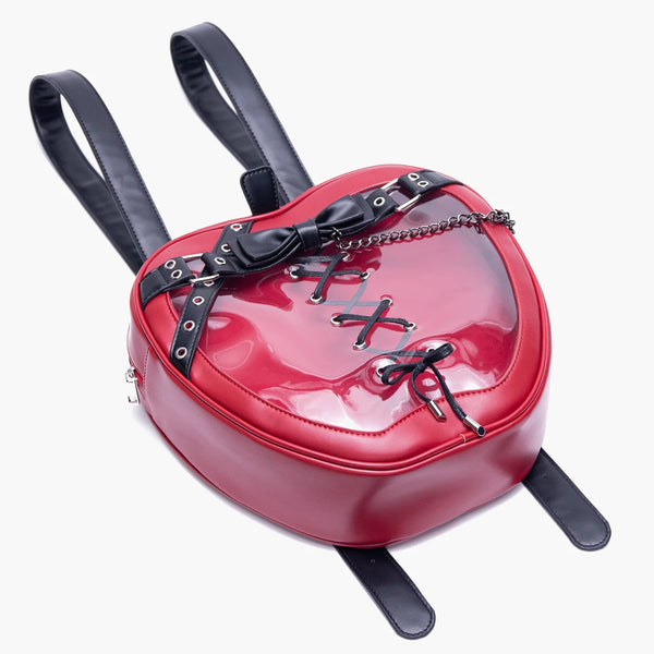 Red heart-shaped backpack with black accents on a white background