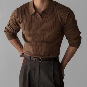 Brown ribbed sweater and dark pants on a gray background