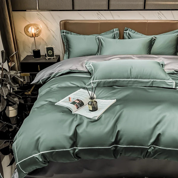 Green bedding set on a bed in a bedroom setting with decor elements.