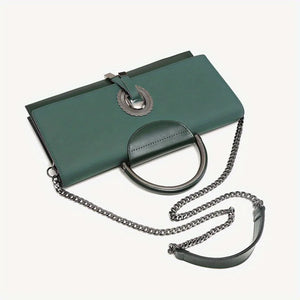 Green handbag with chain strap on a white background