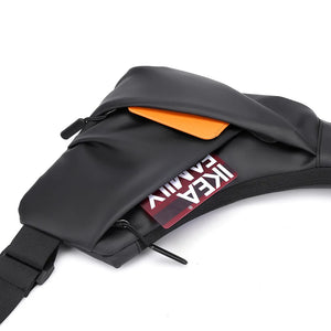 Black waist bag with orange interior and visible brand logo on a white background