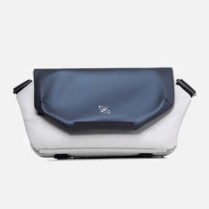 Blue and white bag with a visible brand logo on a white background
