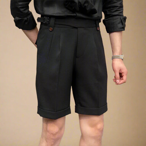 Person wearing black shorts with a blurred background