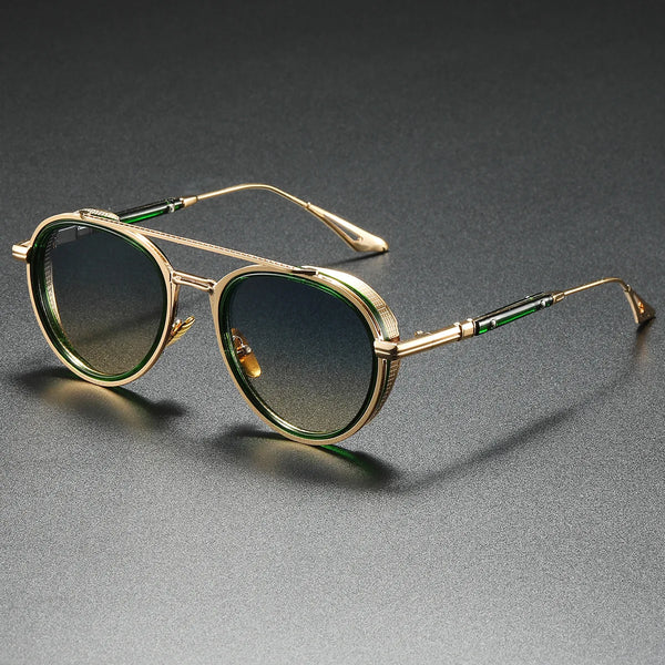 Gold-framed sunglasses with dark lenses on a gray background