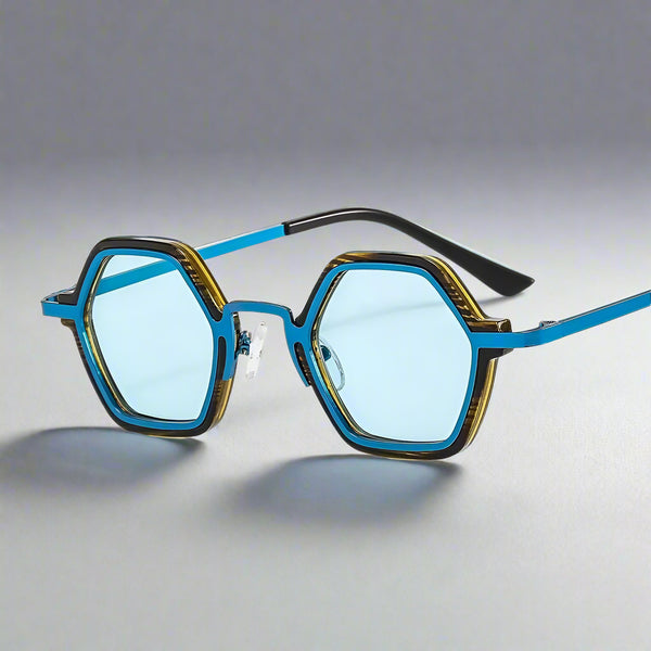 Sunglasses with blue lenses and gold and black frame on a white background